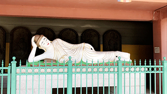 Buddha statue laying on its side